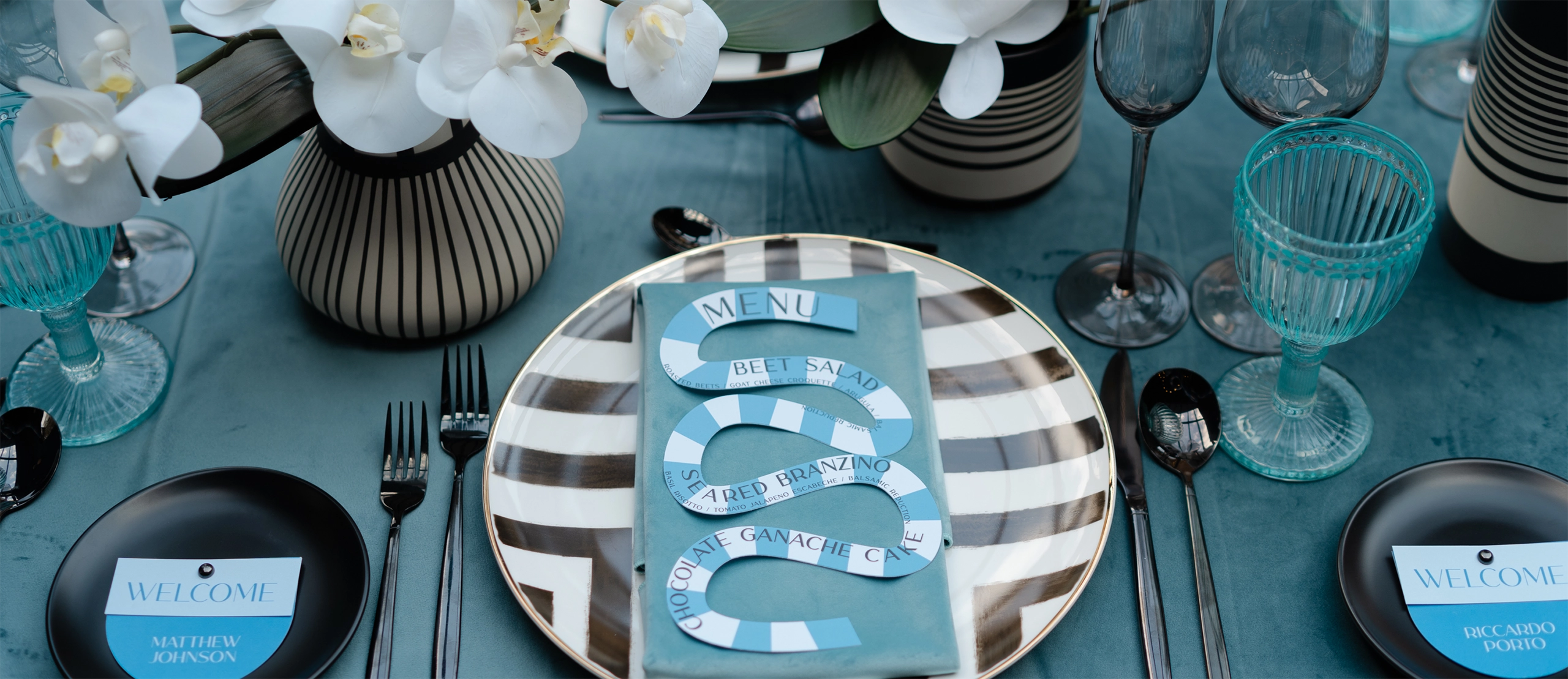 Close up photo of a dinner plate setup for a catered corporate dinner event