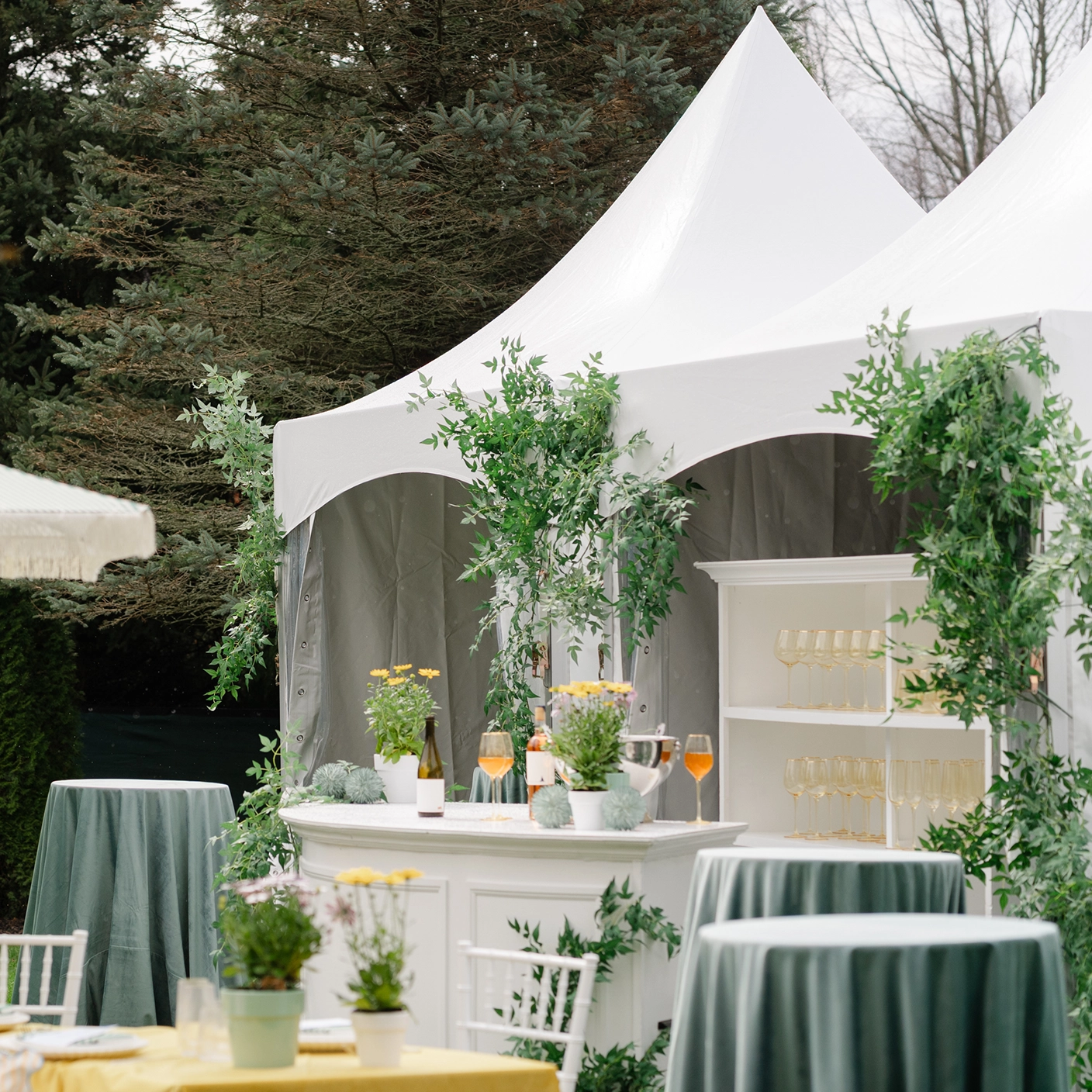 High-peak tent used for an outdoor bar at an event