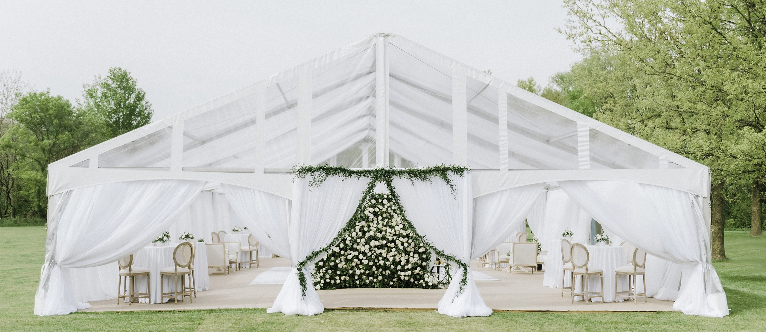 White high-peak tent rental for outdoor wedding reception