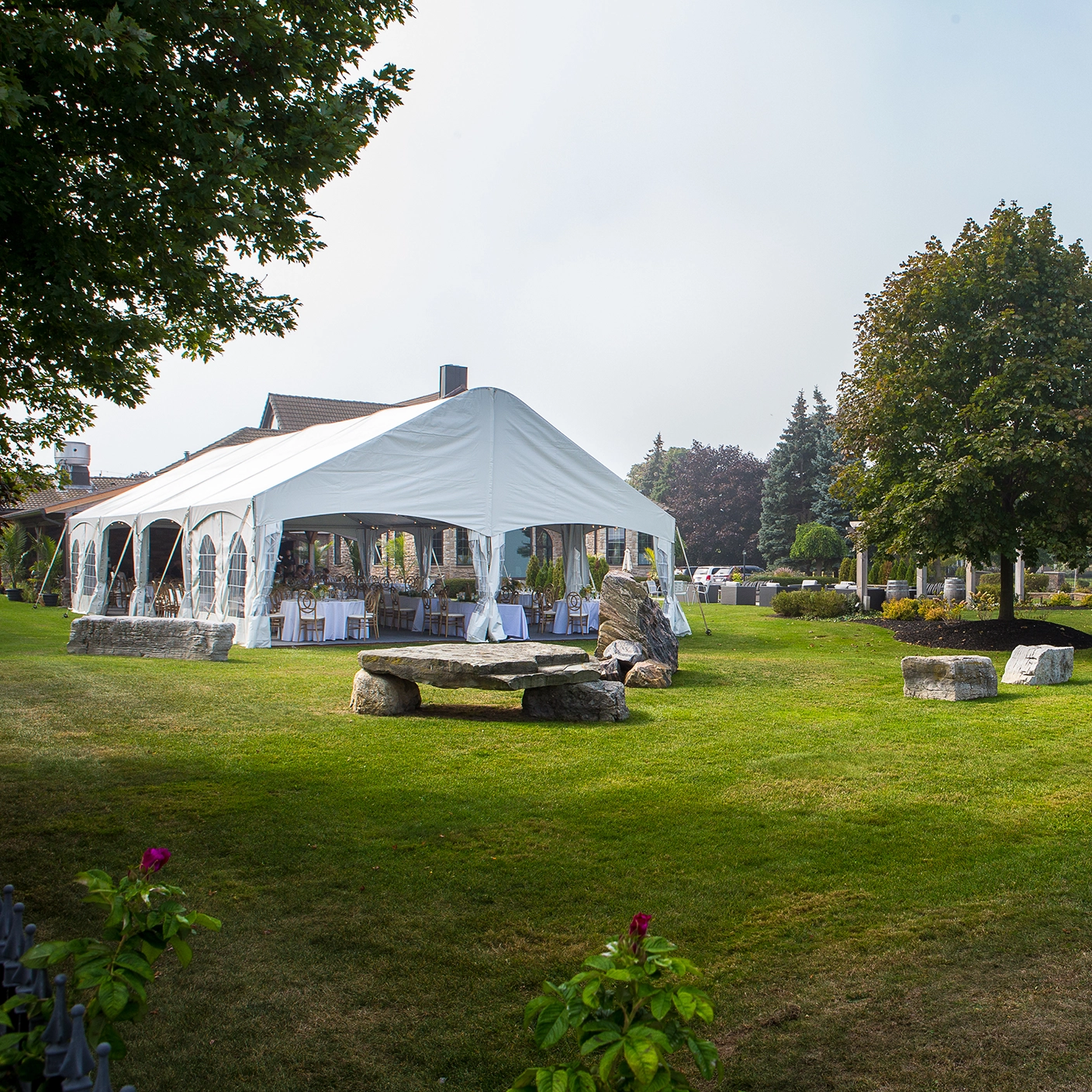 Outdoor dinner event with legacy tent rental from Special Event Rentals in Burlington