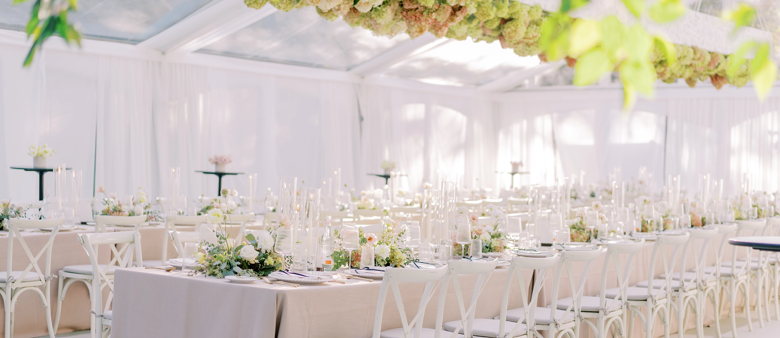 Wedding reception rentals with white linens and white chairs
